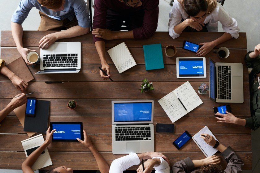 desk with people and devices